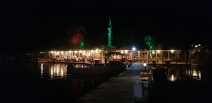 Night scene showing the yachts moored with lights in the background