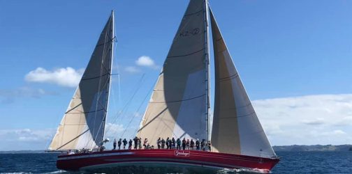 Steinlager 2 under full sail with beautiful seas and blue sky and lots of our participants on the deck waving