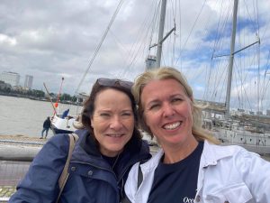 Judith and Thea smile for the cameras on board SV Poseidon